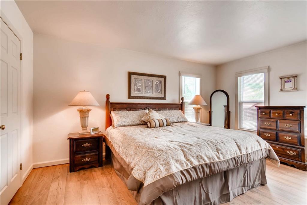 738 Deer Path Road Dillon, CO 80435 - Photo 11 of 25 a bedroom with a bed and a wooden floor