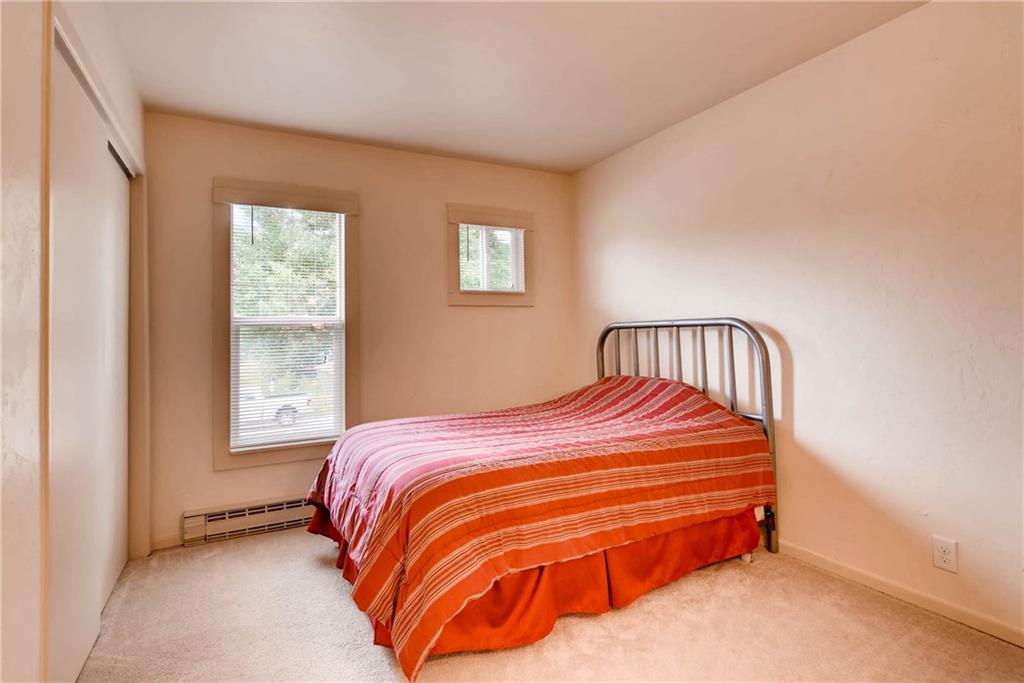 738 Deer Path Road Dillon, CO 80435 - Photo 14 of 25 a bedroom with a bed and window