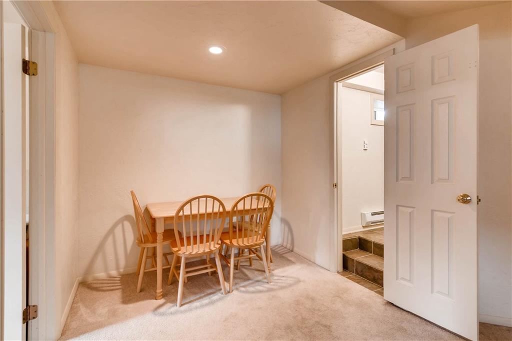 738 Deer Path Road Dillon, CO 80435 - Photo 18 of 25 a view of a dining room with furniture and a chandelier