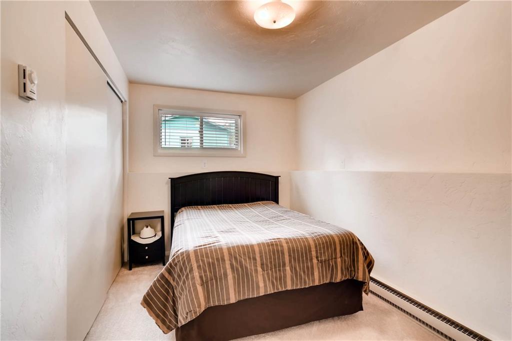 738 Deer Path Road Dillon, CO 80435 - Photo 19 of 25 a bedroom with a bed and a window