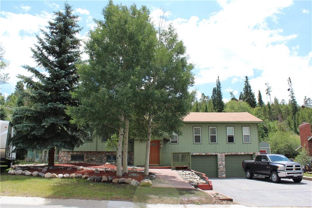 738 Deer Path Road Dillon, CO 80435 - Photo 3 of 25 a front view of a house with a garden and trees