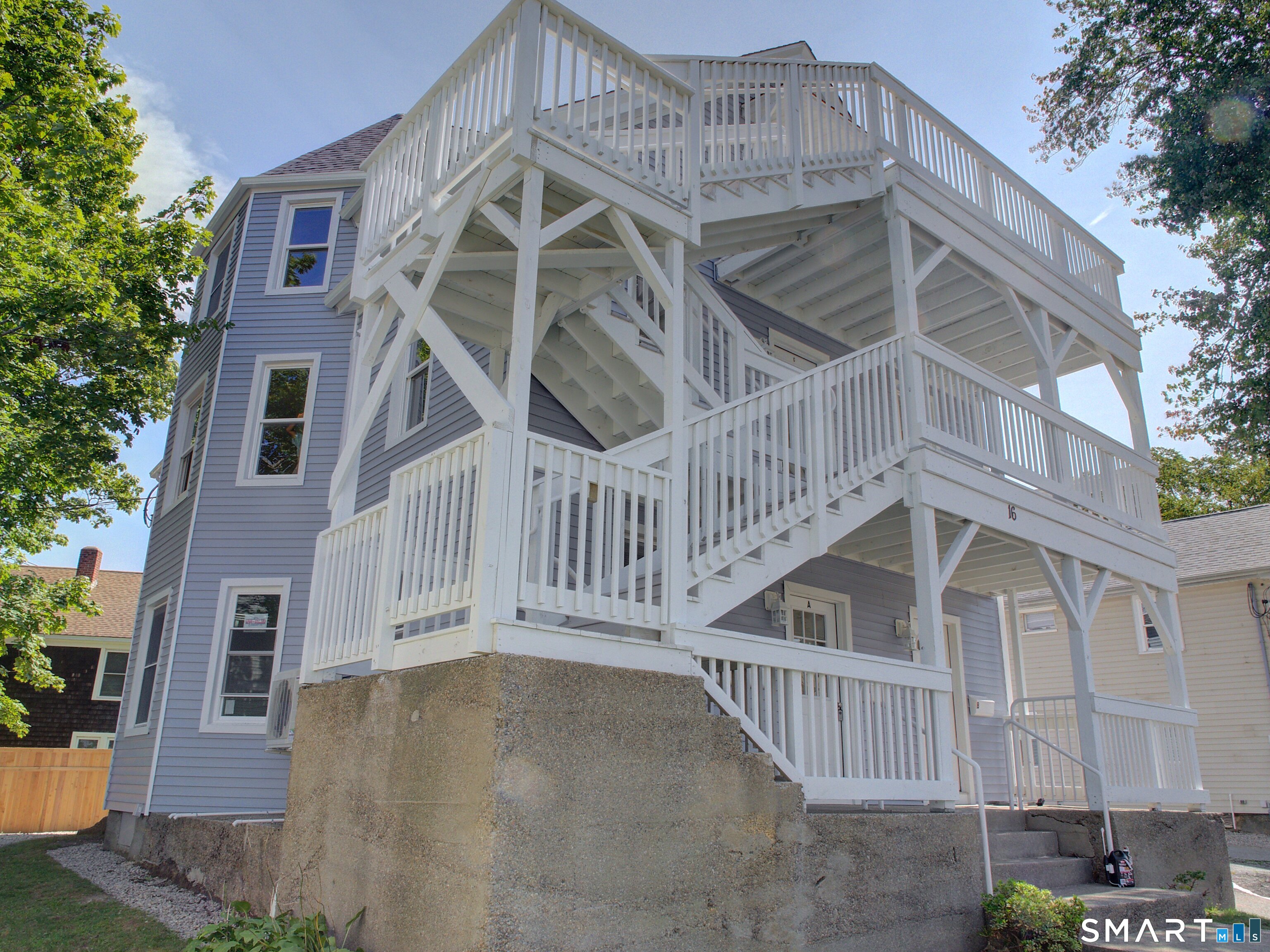 16 Benham Road, Unit D Groton, CT 06340 - Photo 2 of 15 a view of a house with a yard