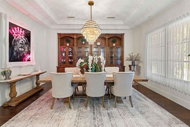 a living room with stainless steel appliances kitchen island granite countertop furniture and a sink