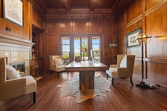 a view of a livingroom with furniture and natural light