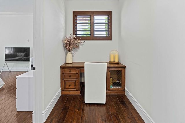 a view of a patio with table and chairs