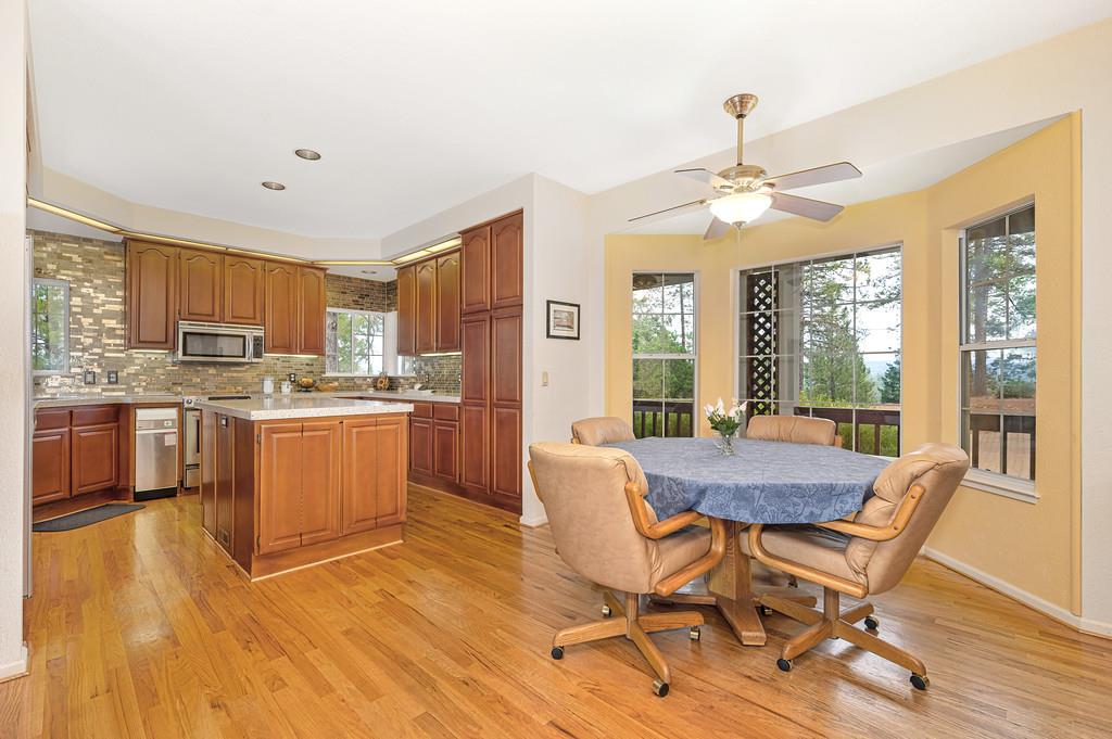 2358 Deer Ravine Court Cool, CA 95614 - Photo 9 of 63 dining space with light wood-type flooring and a ceiling fan