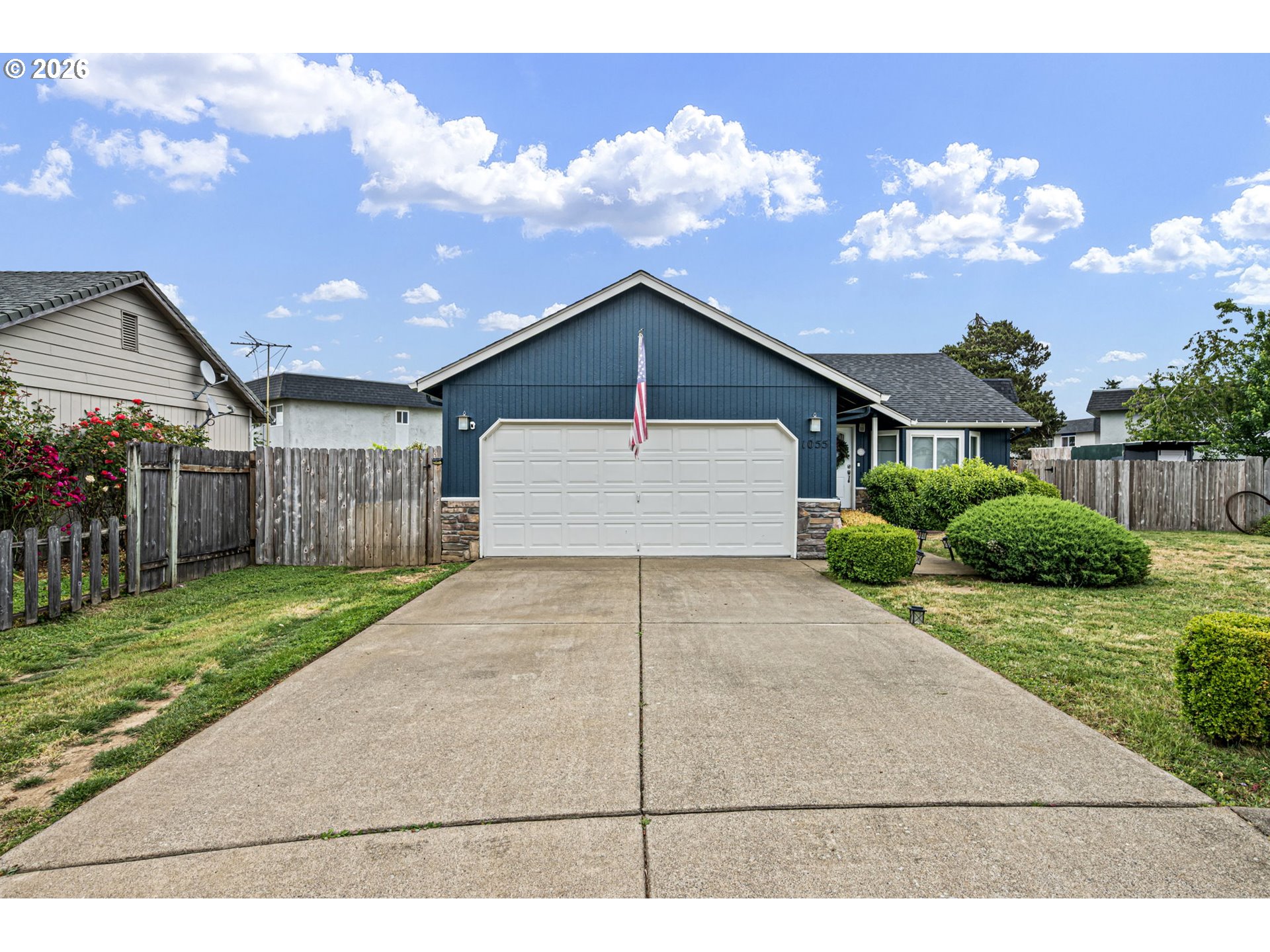 1055 Ash Grove Loop Creswell, OR 97426 - Photo 2 of 33 a view of a house with a yard