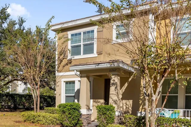 front view of a house with a trees
