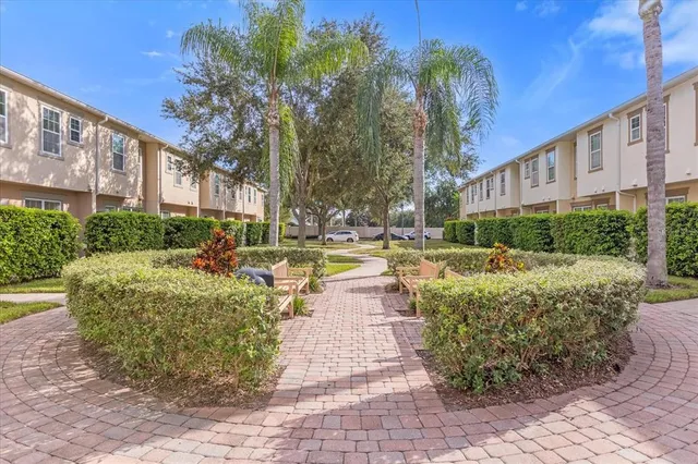 a view of a building with garden and sitting area
