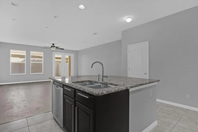 a view of kitchen island with sink