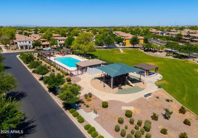 an aerial view of a house with a ocean view