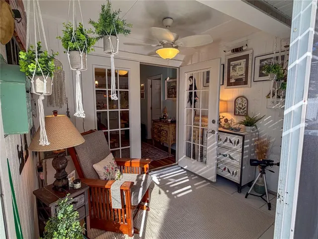 a view of living room kitchen and entryway