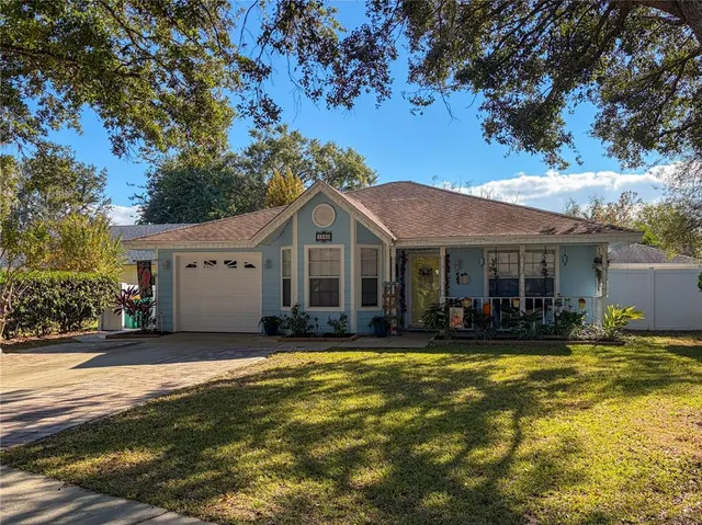 a view of a house with swimming pool and porch with furniture