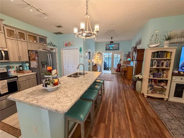 a view of a kitchen and dining room
