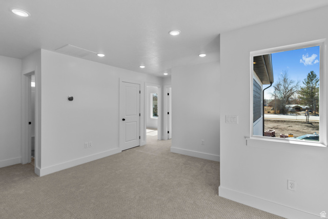 248 West 2920th Street South Logan, UT 84321 - Photo 40 of 47 Recessed ceiling lighting, light-toned carpeting, white interior doors, a white window frame, and white walls