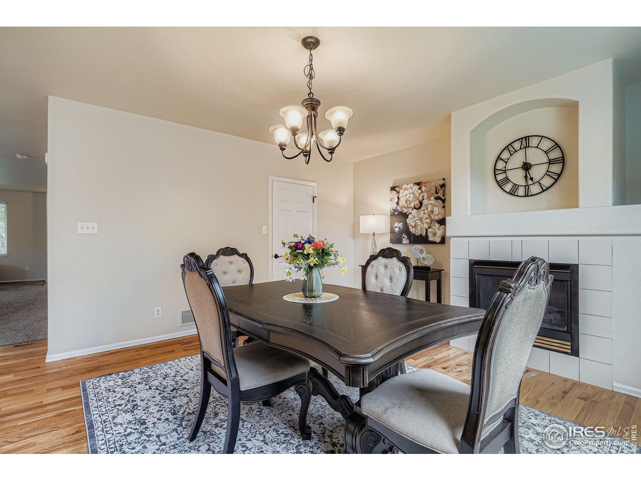 6178 Graden Street Frederick, CO 80530 - Photo 15 of 28 a view of a dining room with furniture and chandelier