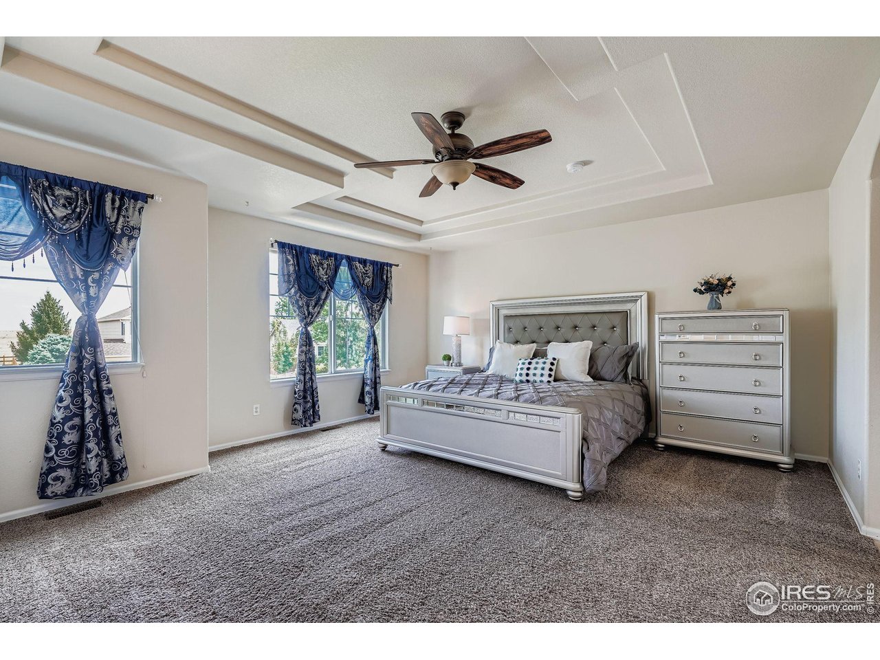 6178 Graden Street Frederick, CO 80530 - Photo 17 of 28 a spacious bedroom with a bed and a window