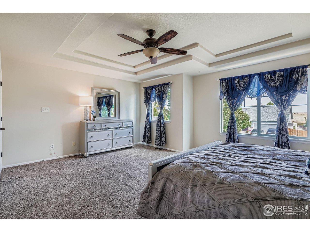 6178 Graden Street Frederick, CO 80530 - Photo 18 of 28 a view of a livingroom with a ceiling fan and window