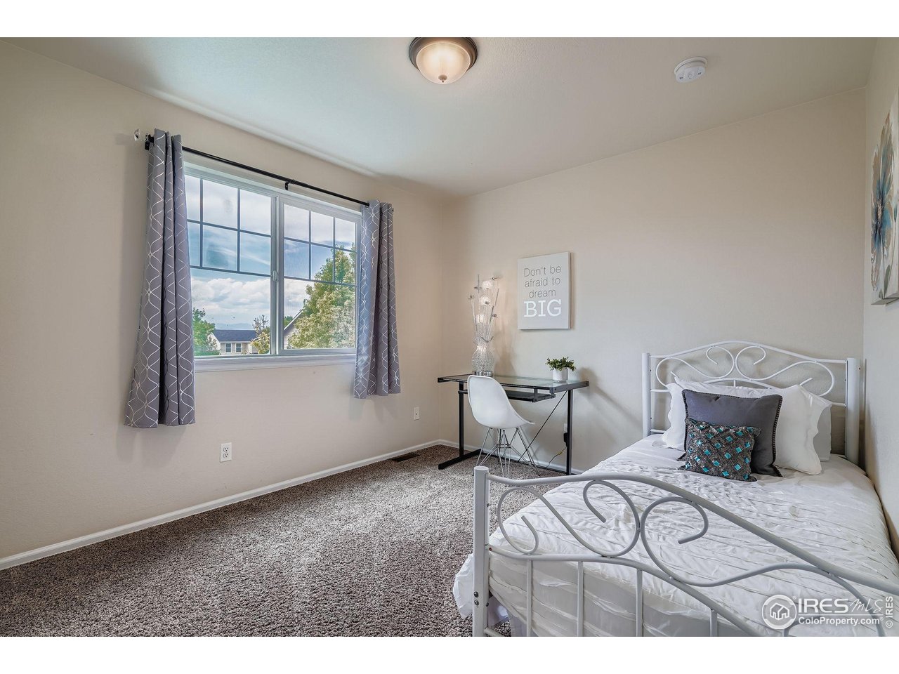 6178 Graden Street Frederick, CO 80530 - Photo 22 of 28 a bedroom with furniture and a window