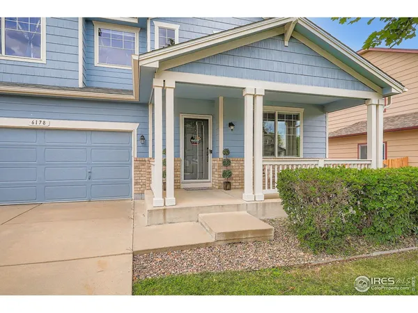 a view of a house with small yard