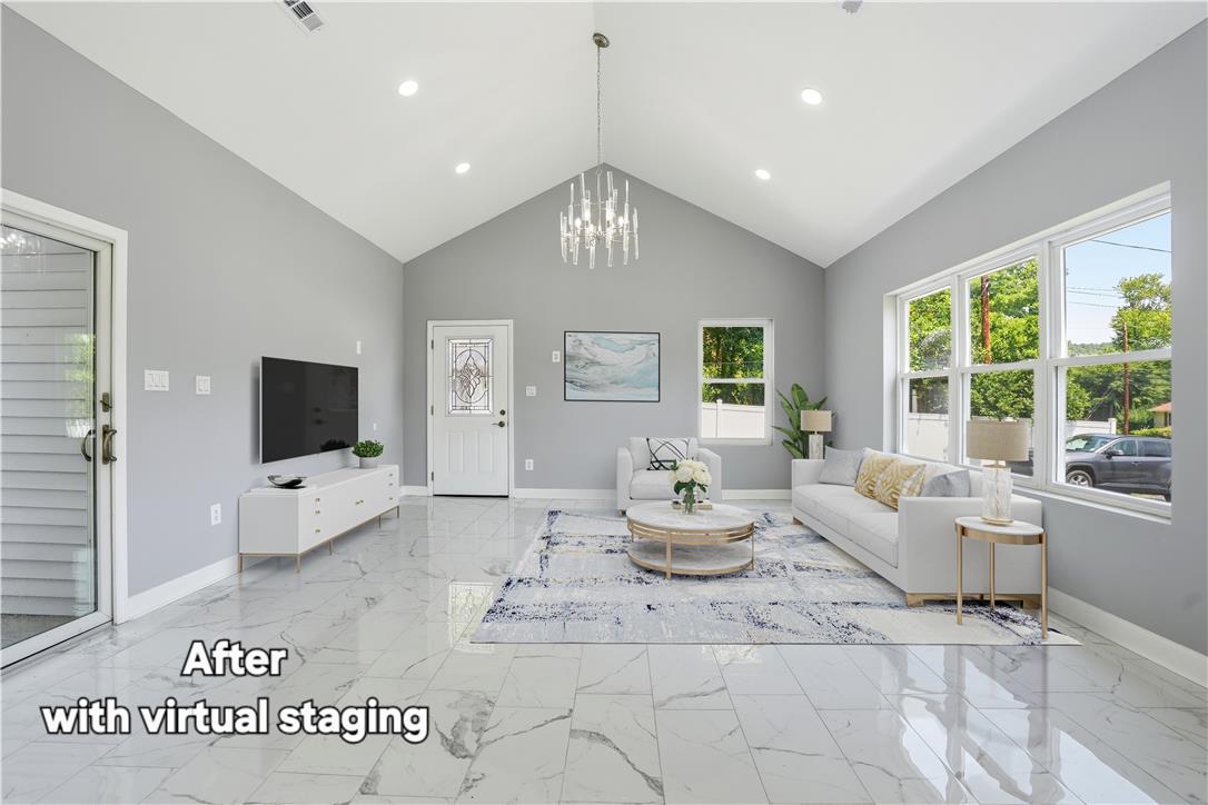 601 Fireline Road Bowmanstown, PA 18071 - Photo 23 of 27 Lofty vaulted ceilings and large windows define this luminous living space, perfect for relaxing.