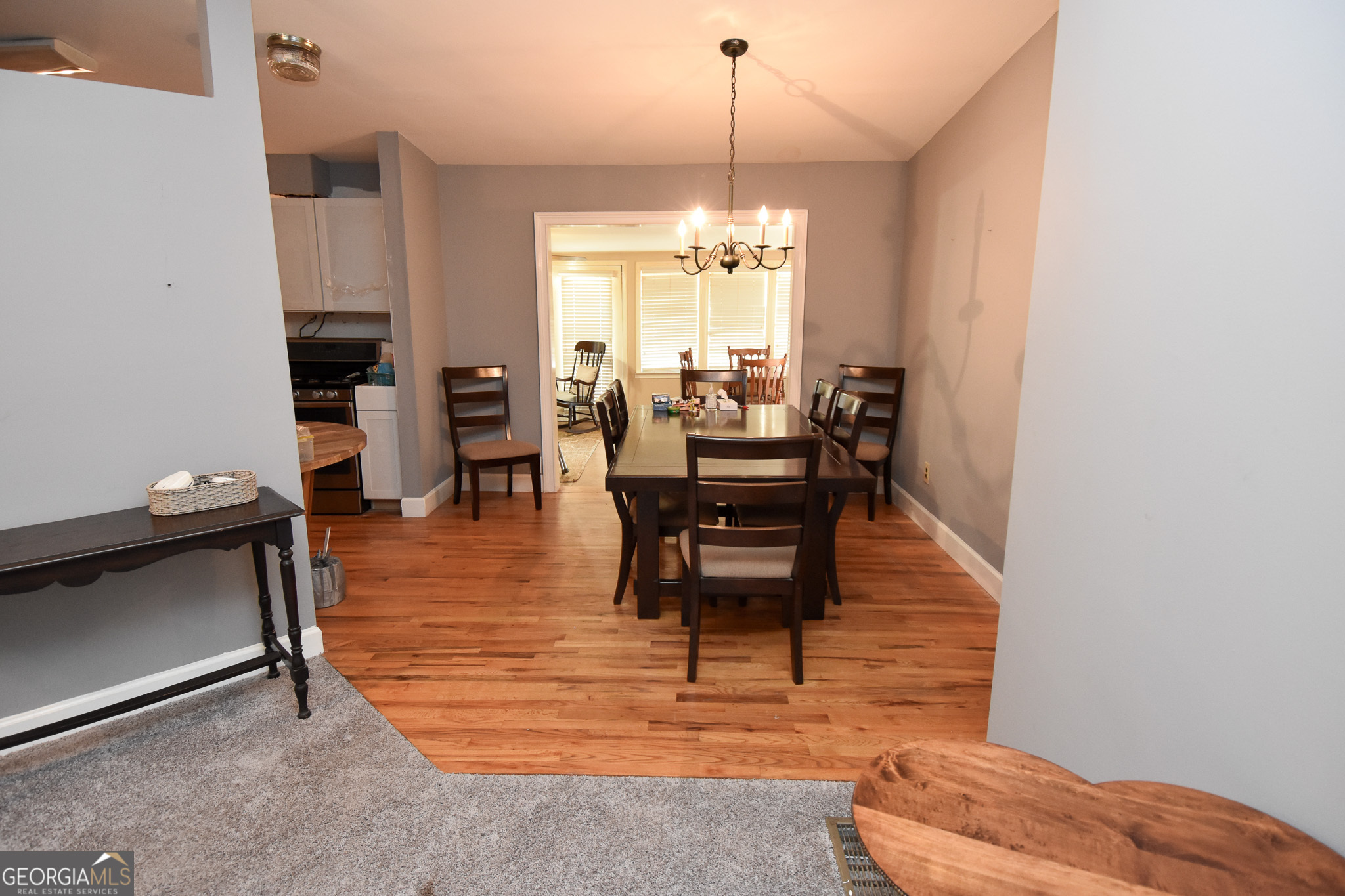 1256 Vaughn Road Griffin, GA 30223 - Photo 12 of 73 a living room with furniture a dining table and a window