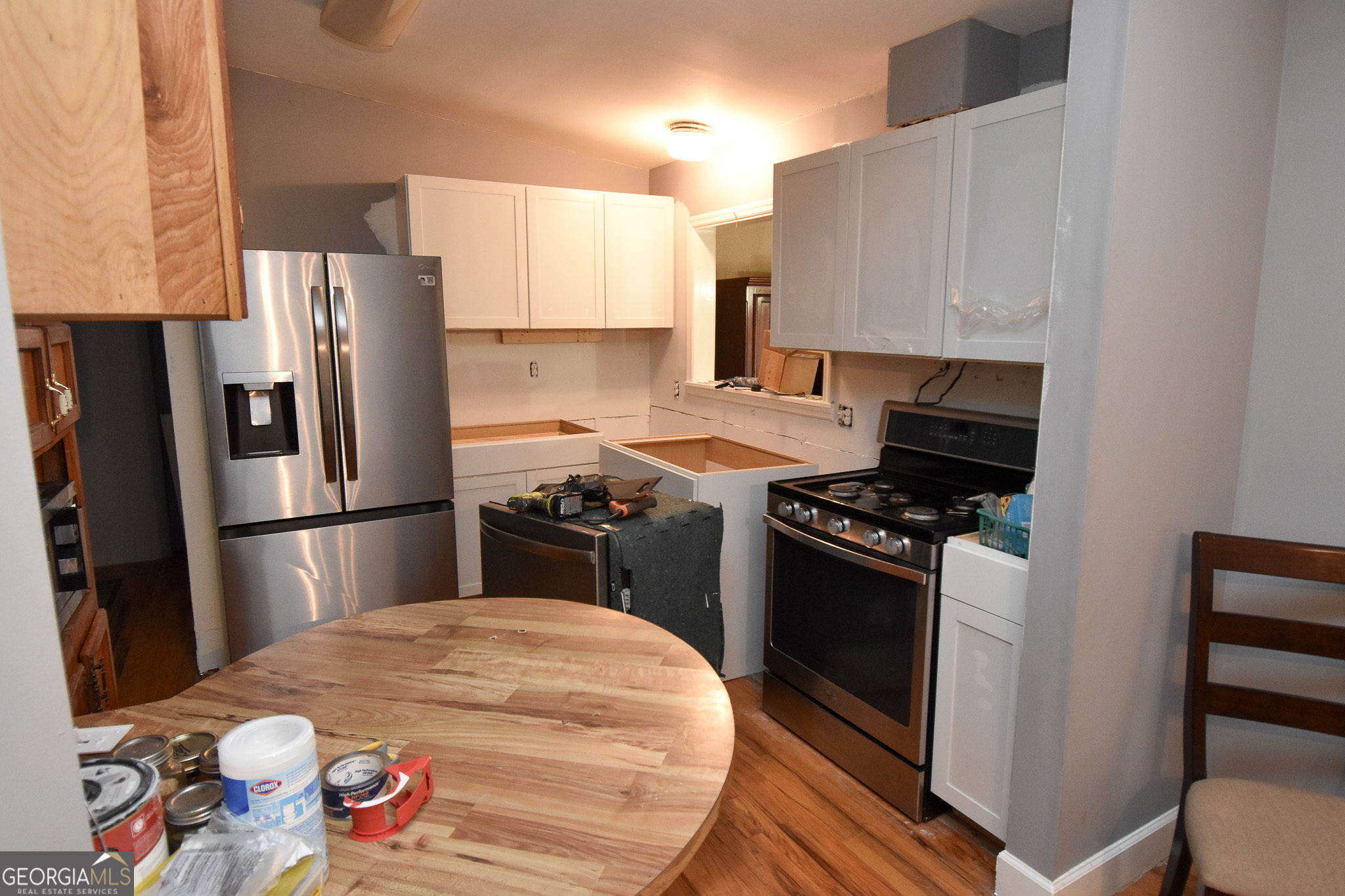 1256 Vaughn Road Griffin, GA 30223 - Photo 14 of 73 a kitchen with stainless steel appliances a refrigerator a stove a sink and a refrigerator