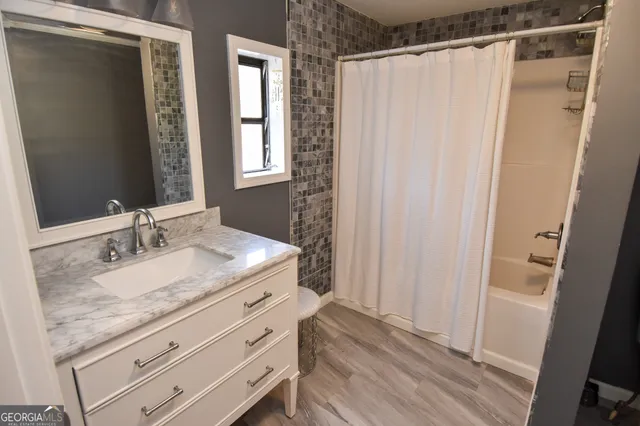 a white toilet sitting next to a bathroom sink