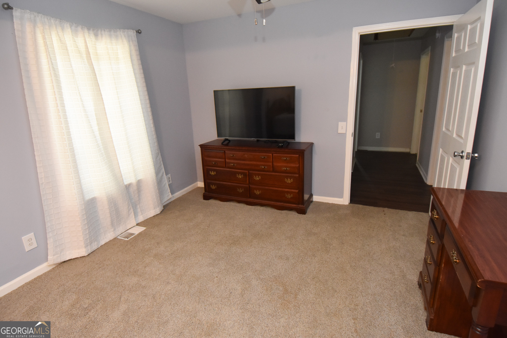 1256 Vaughn Road Griffin, GA 30223 - Photo 28 of 73 a view of room with furniture and a flat screen tv