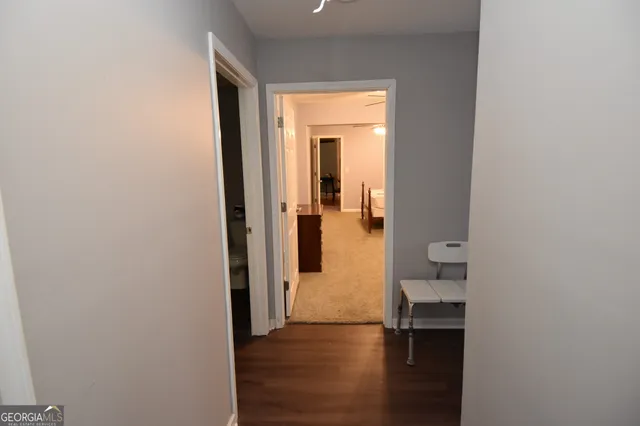 a view of a livingroom with furniture and a window