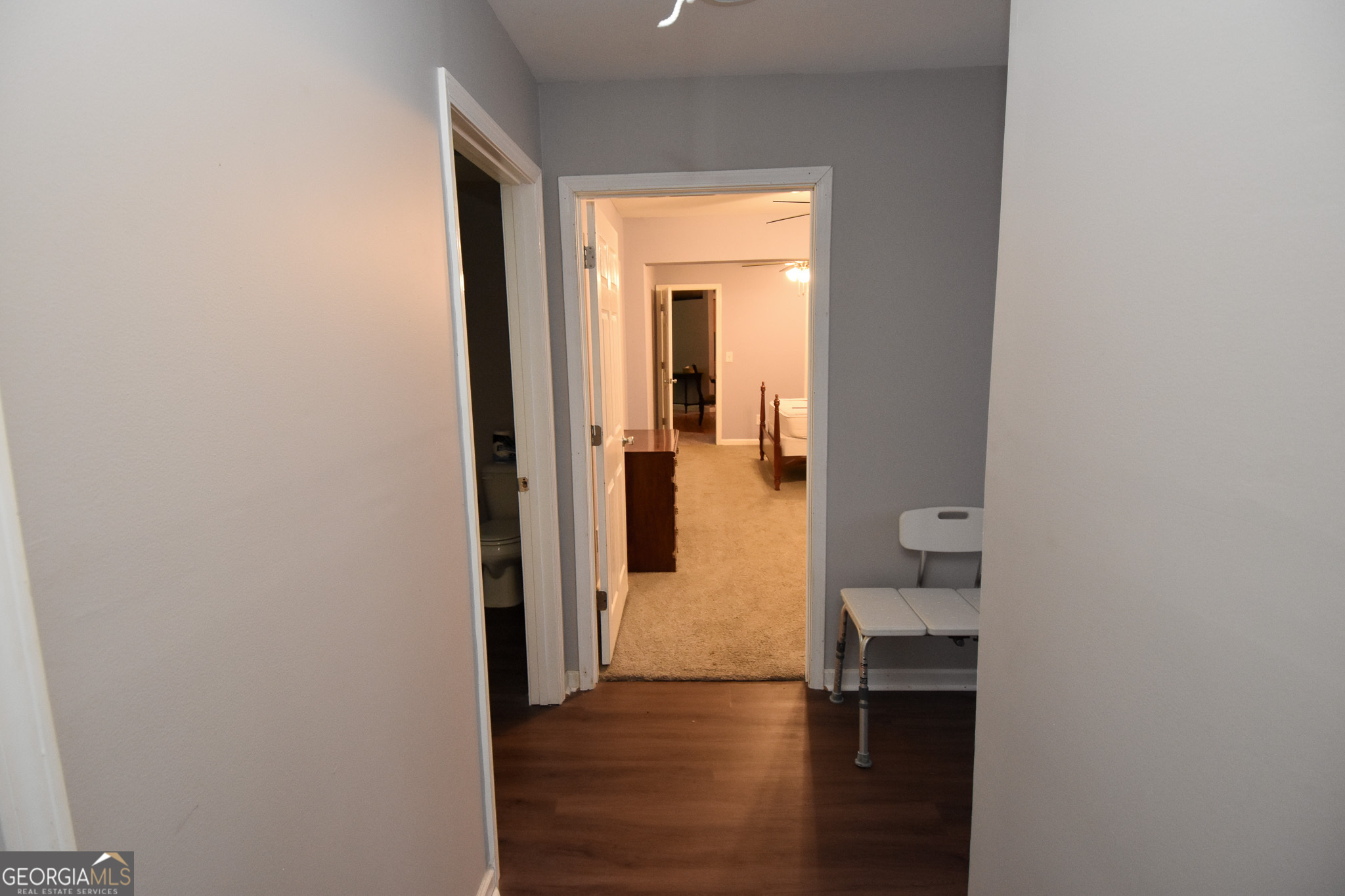 1256 Vaughn Road Griffin, GA 30223 - Photo 31 of 73 a view of a room with wooden floor windows and a bathroom