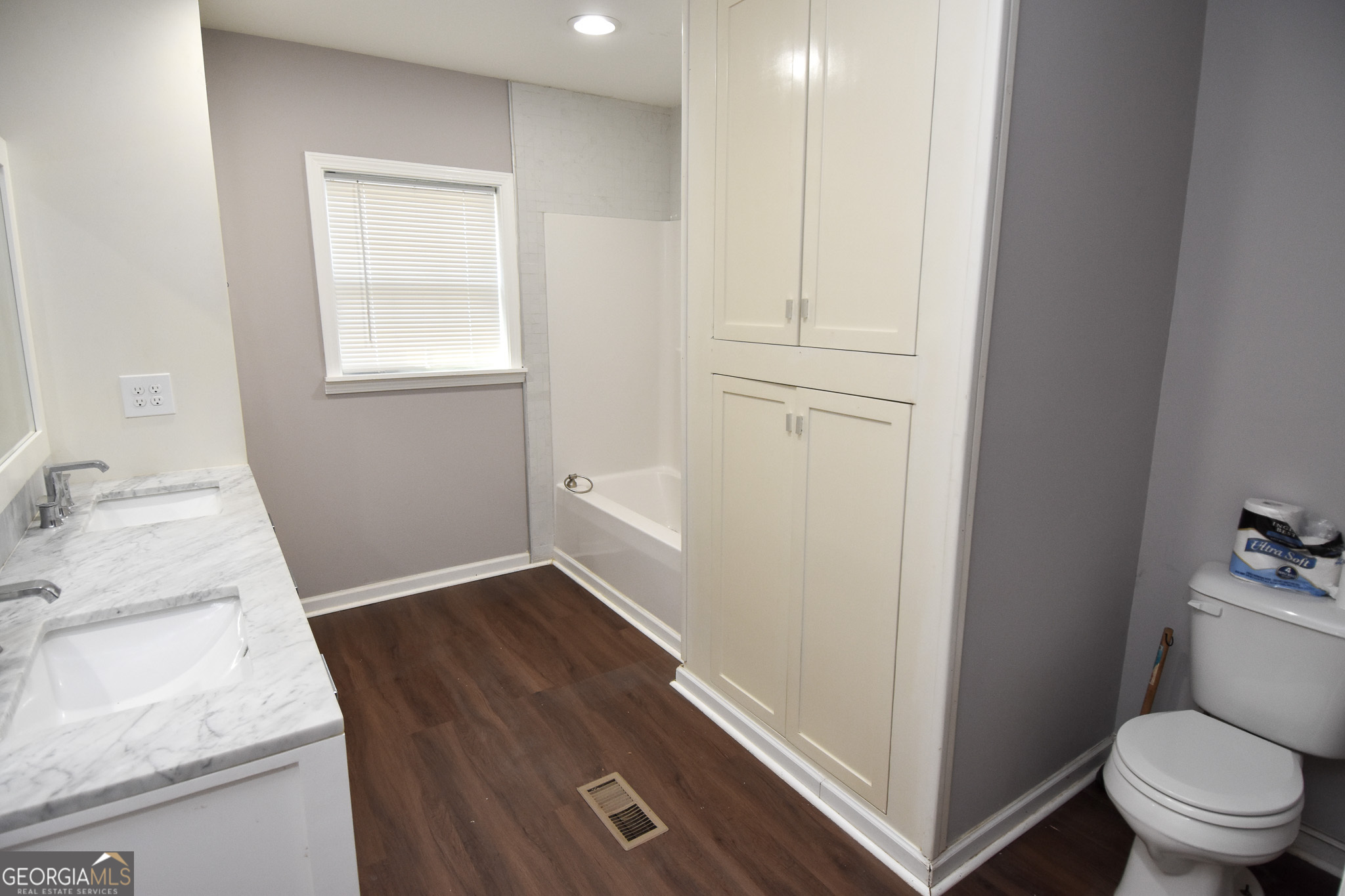 1256 Vaughn Road Griffin, GA 30223 - Photo 32 of 73 a bathroom with a sink a toilet and a window