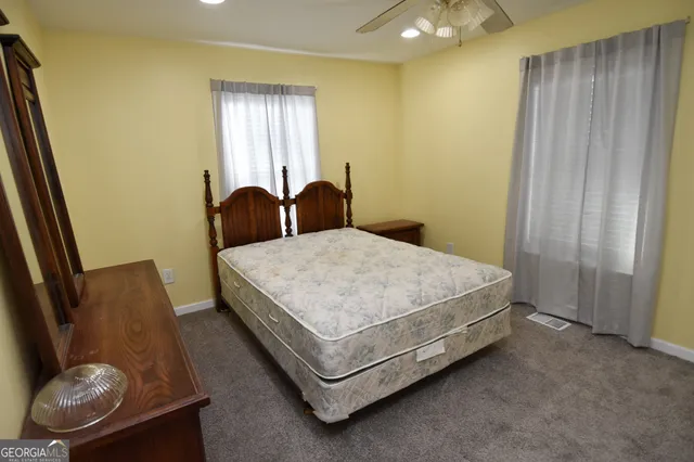 a view of a backyard with sitting area