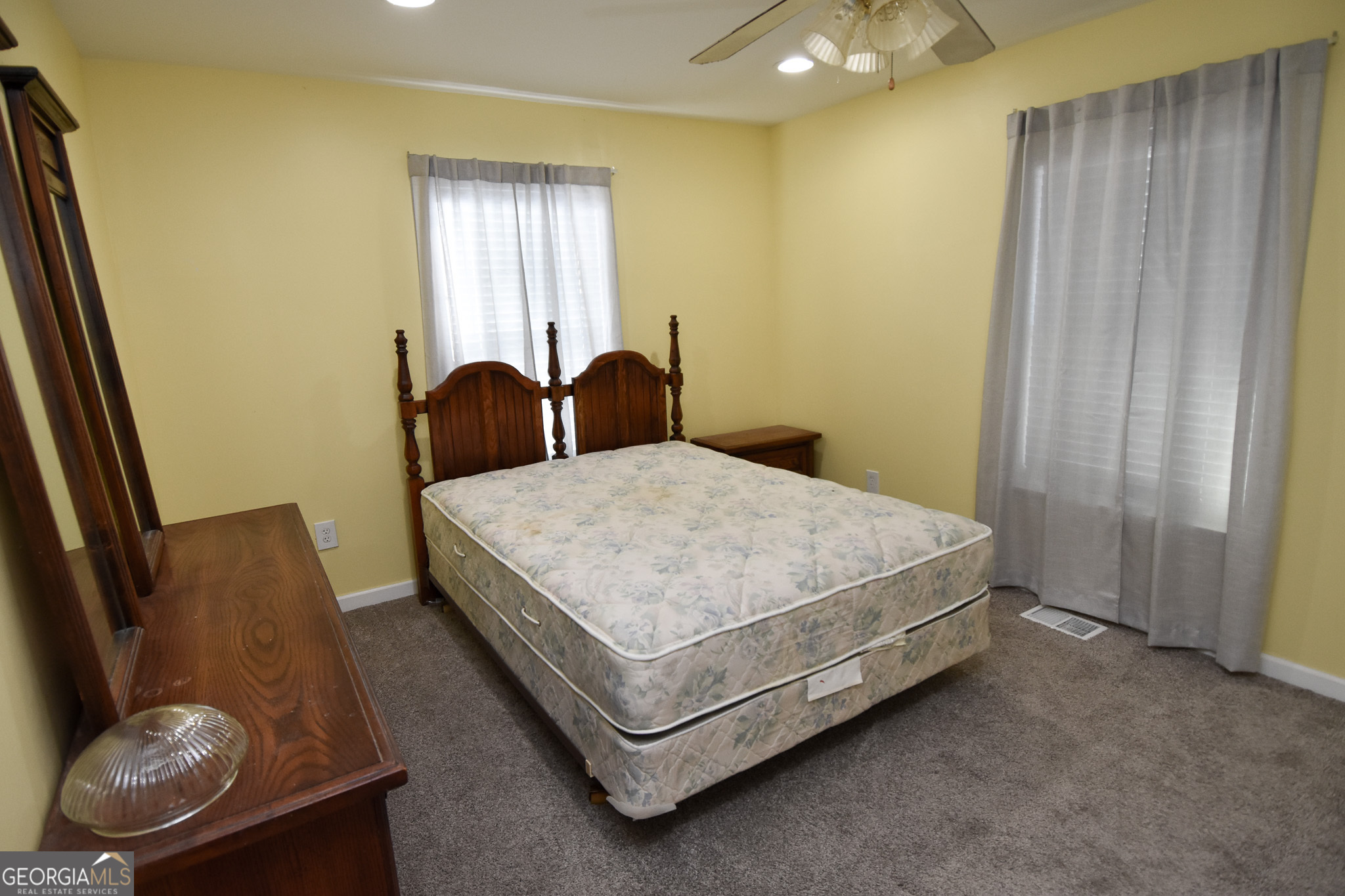 1256 Vaughn Road Griffin, GA 30223 - Photo 34 of 73 a bed sitting in a room next to a window