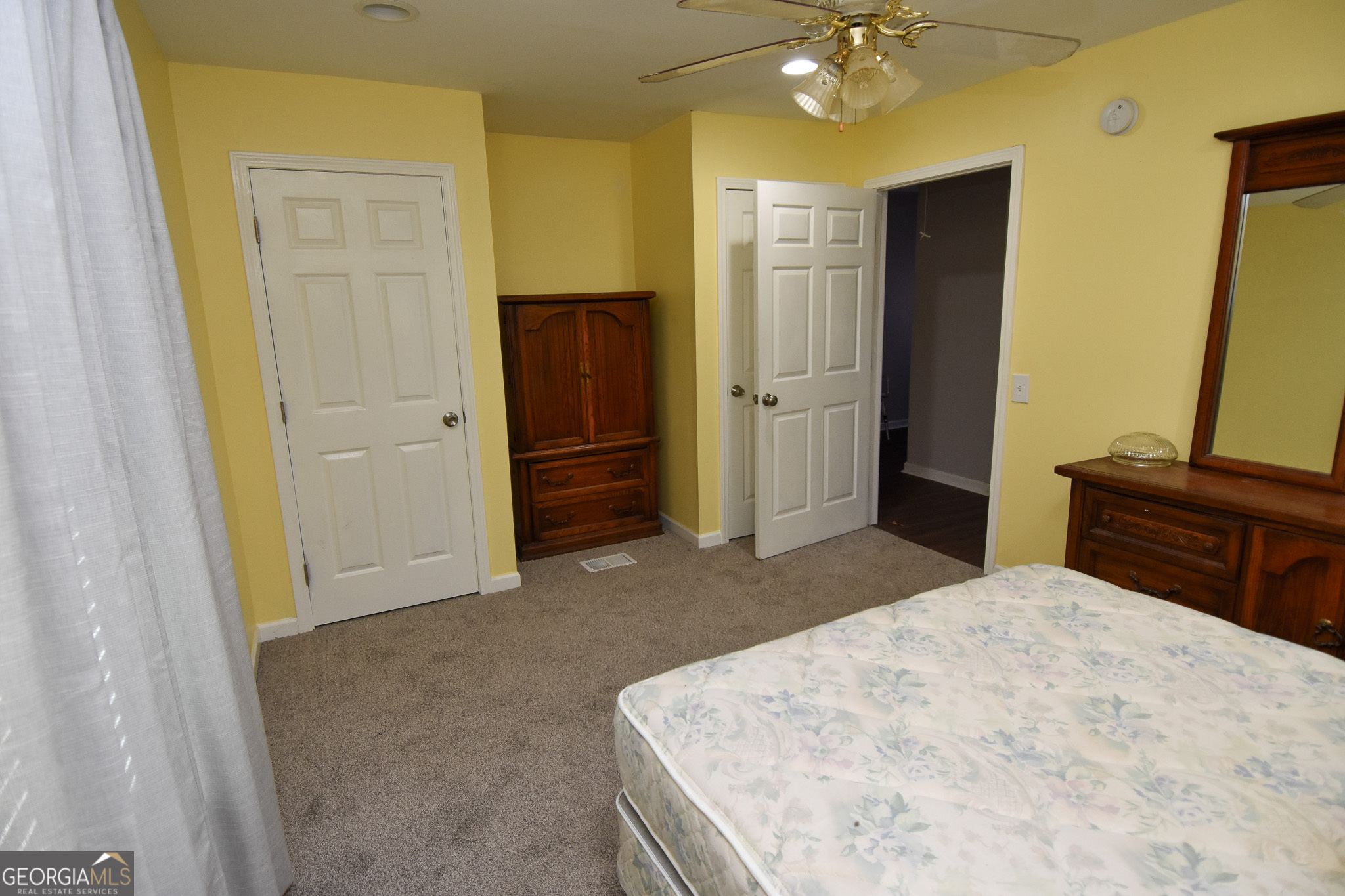 1256 Vaughn Road Griffin, GA 30223 - Photo 35 of 73 a bedroom with a bed and a dresser