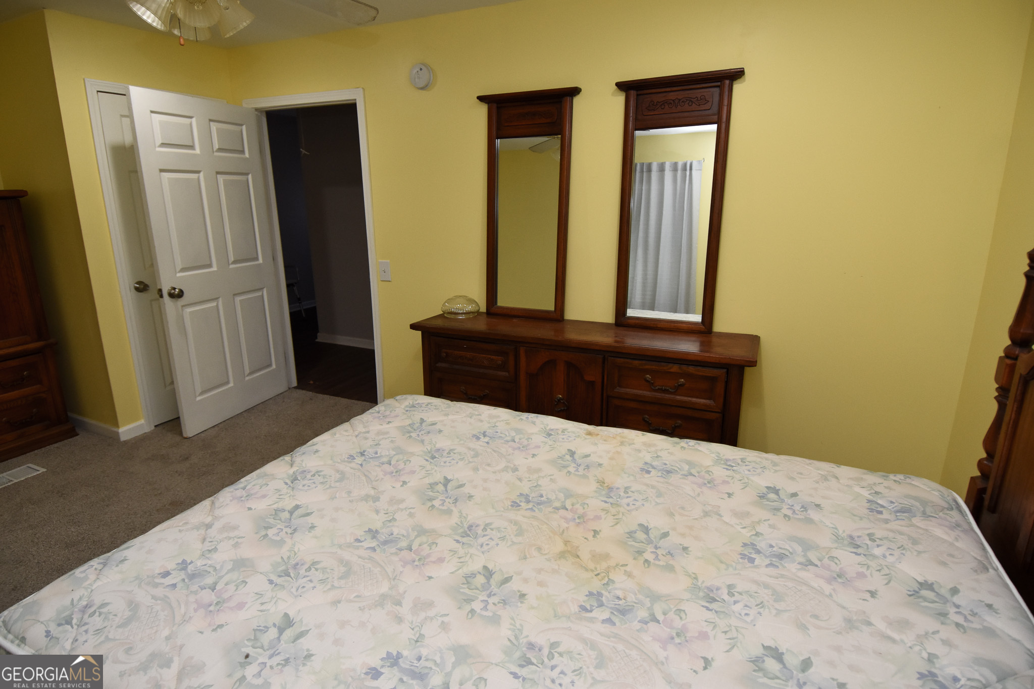 1256 Vaughn Road Griffin, GA 30223 - Photo 36 of 73 a bedroom with a bed and a dresser in it