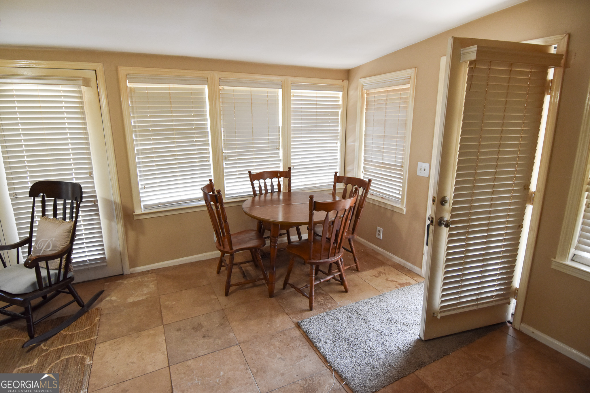 1256 Vaughn Road Griffin, GA 30223 - Photo 43 of 73 a view of a dining room with furniture and windows