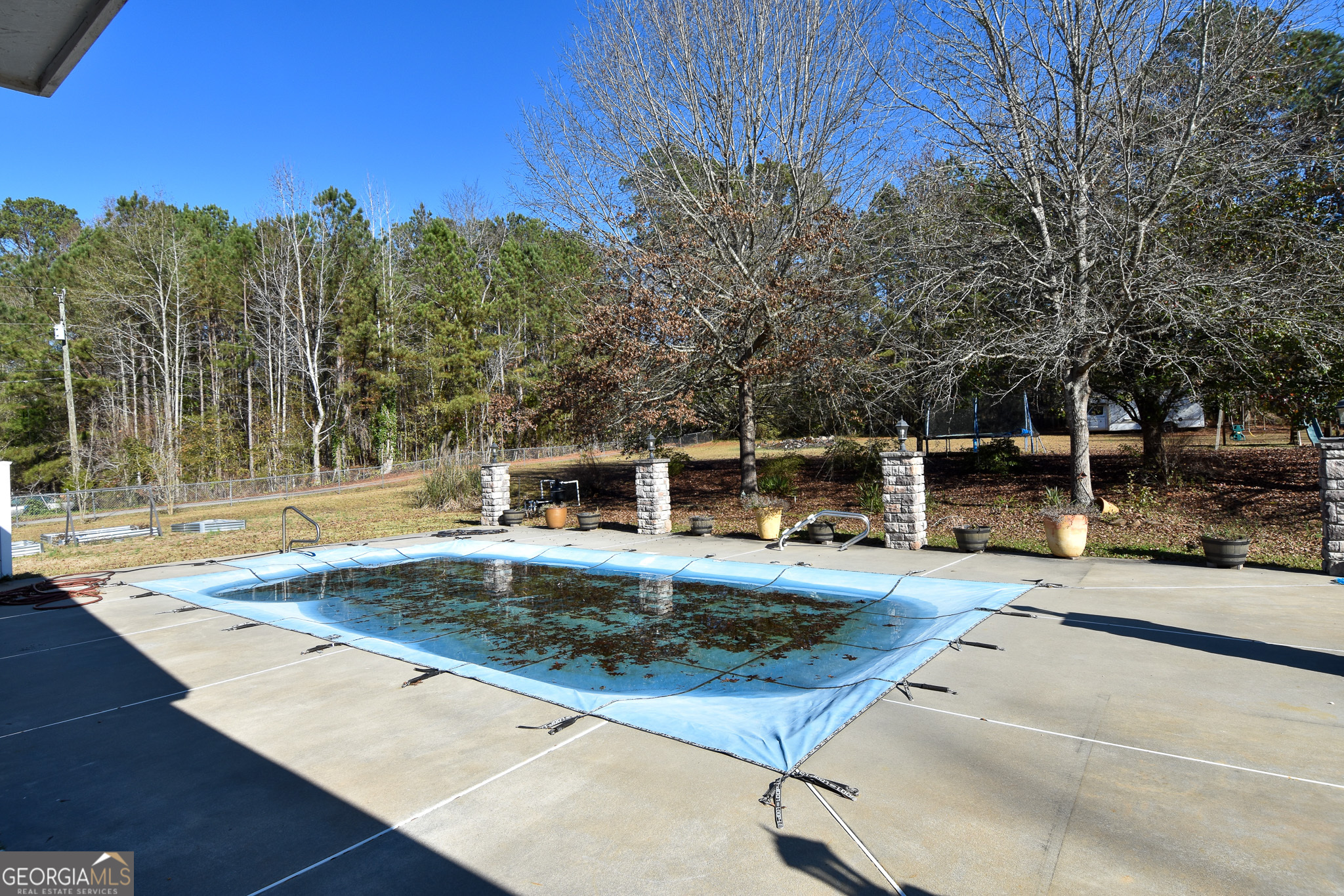 1256 Vaughn Road Griffin, GA 30223 - Photo 49 of 73 a view of a backyard with sitting area