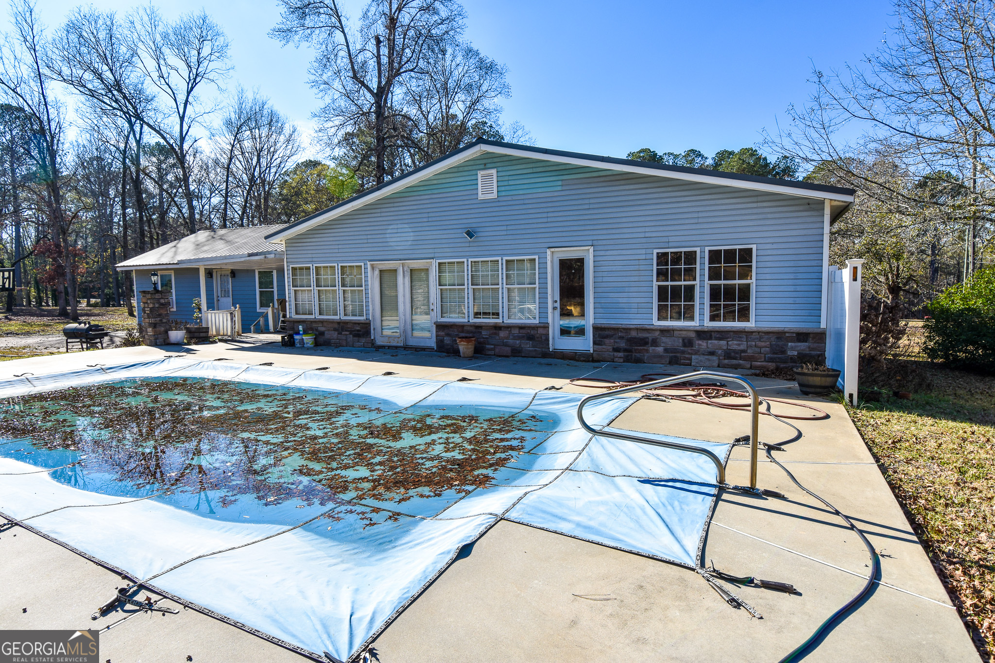 1256 Vaughn Road Griffin, GA 30223 - Photo 51 of 73 a front view of a house with a yard table and chairs