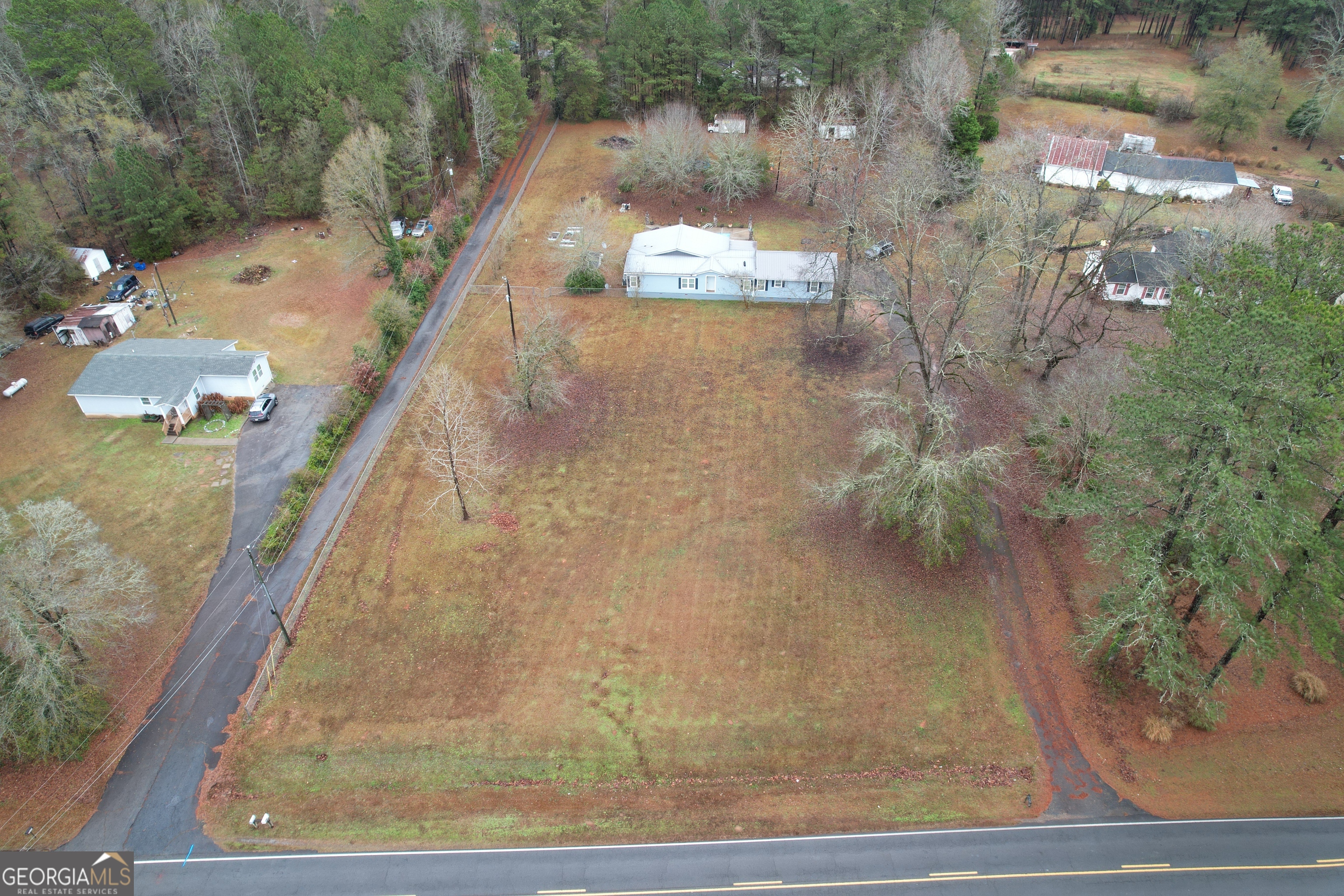 1256 Vaughn Road Griffin, GA 30223 - Photo 57 of 73 a view of a balcony with a floor to ceiling window and tree