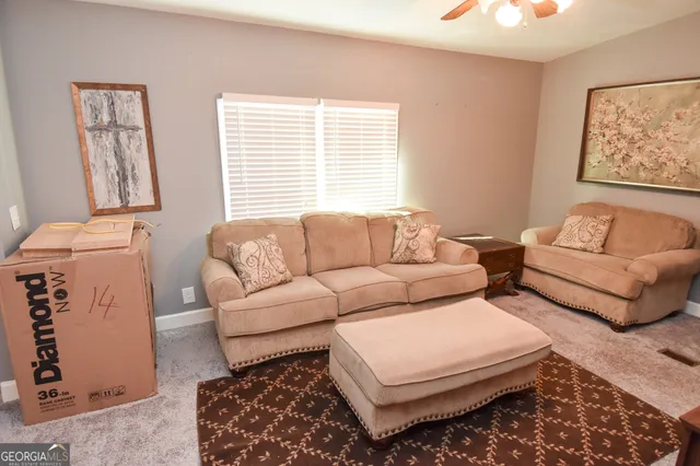 a living room with furniture and a window