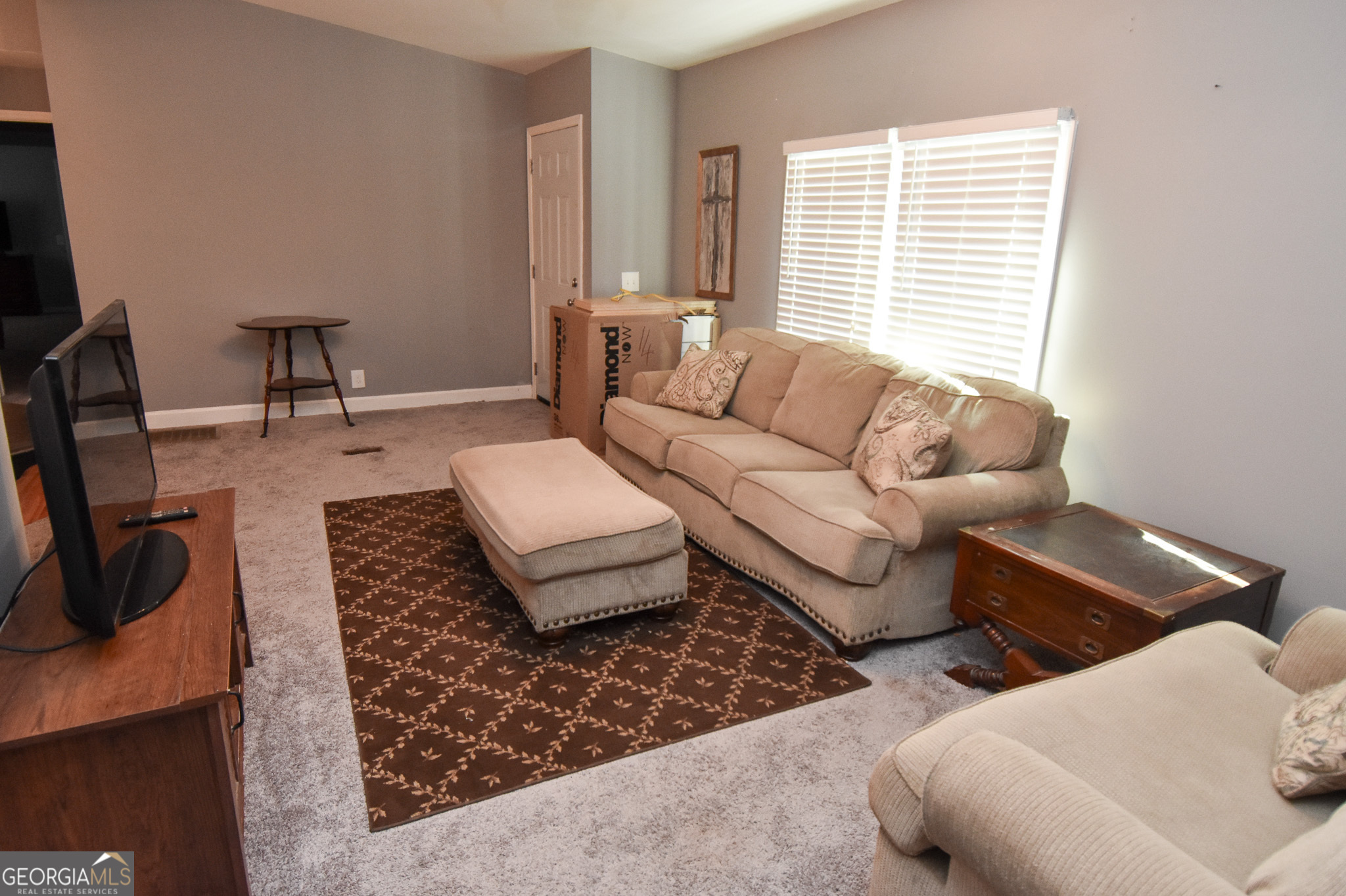 1256 Vaughn Road Griffin, GA 30223 - Photo 10 of 73 a living room with furniture and a window