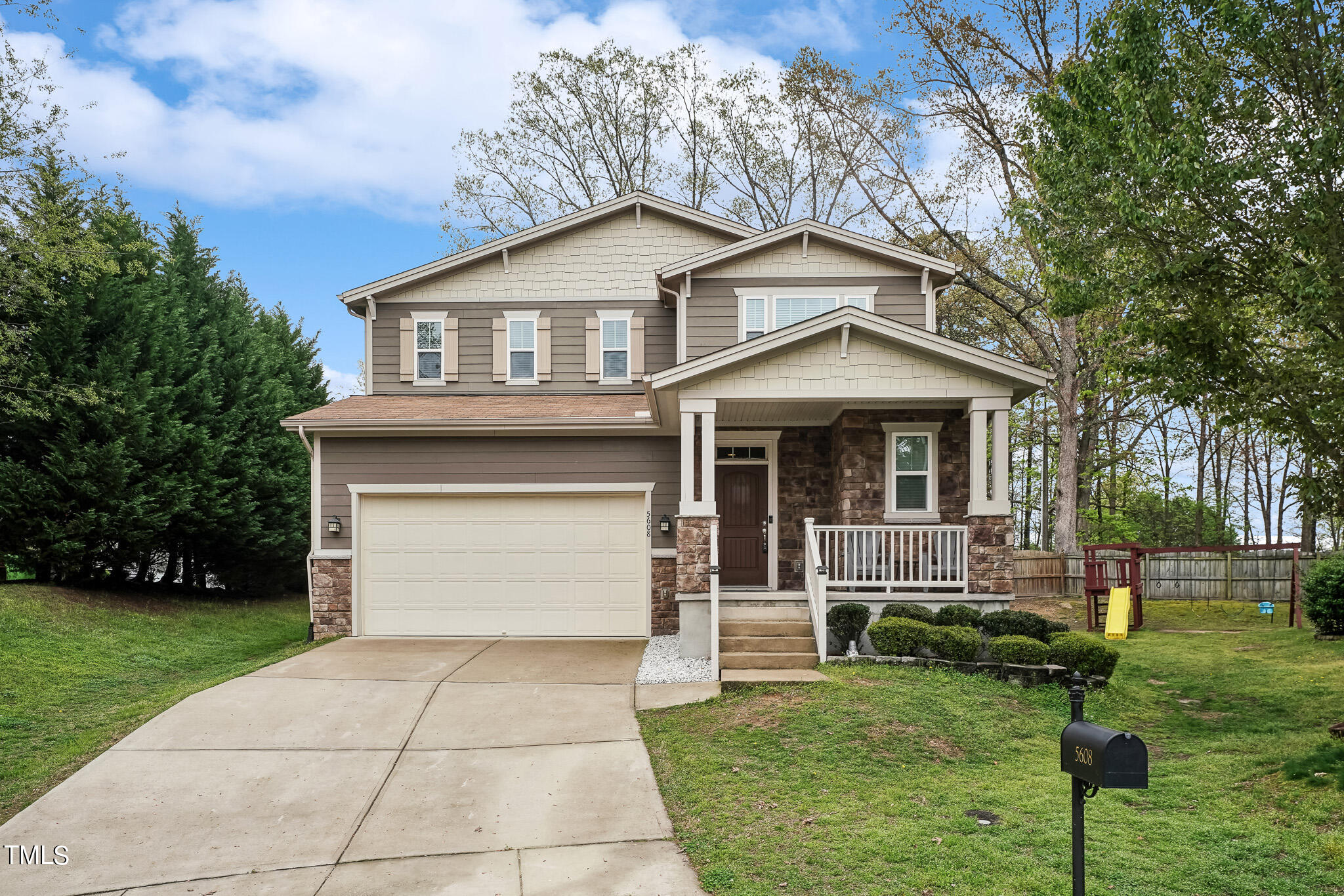 5608 Spring Glen Lane Raleigh, NC 27616 - Photo 1 of 30 a front view of a house with a yard