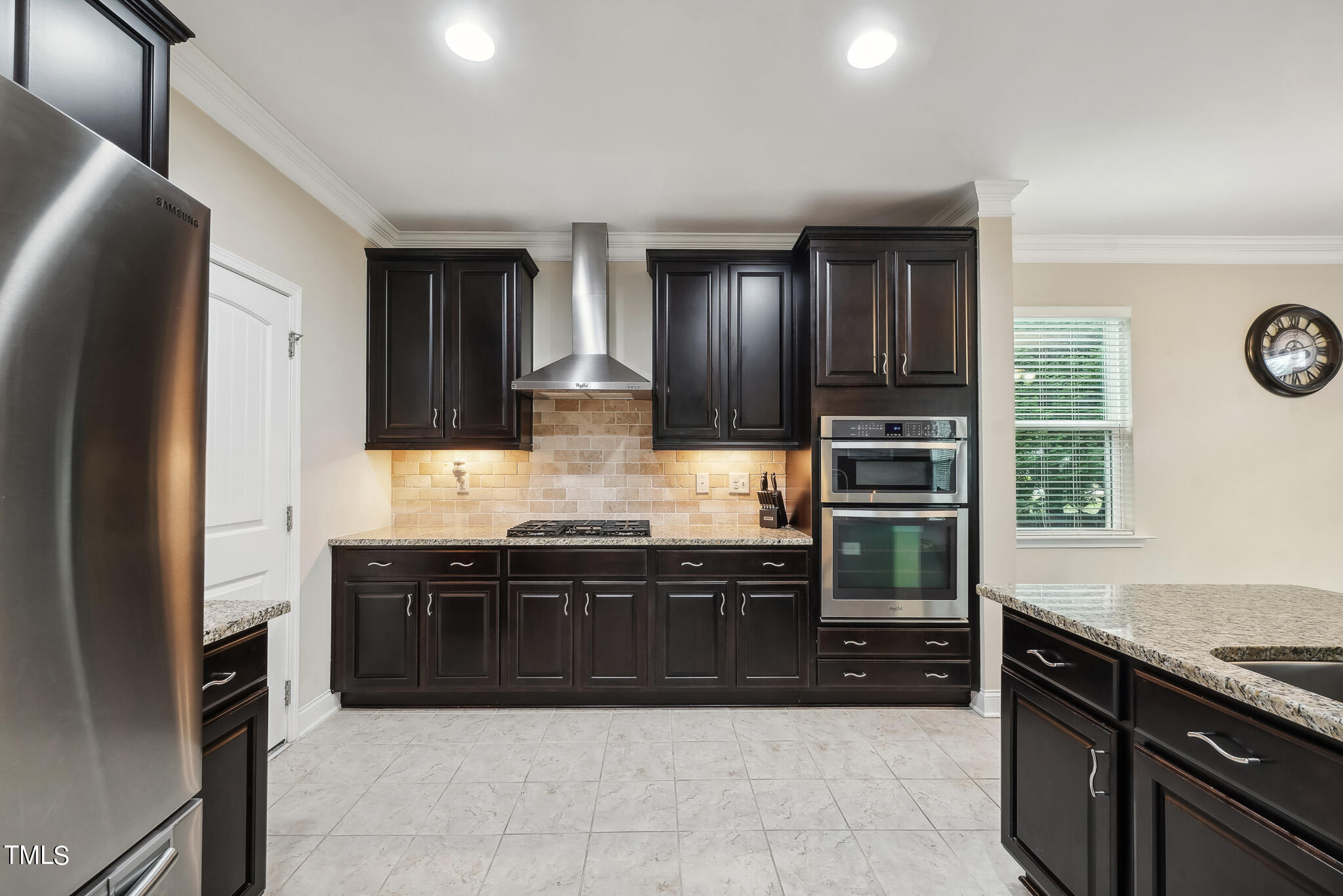 5608 Spring Glen Lane Raleigh, NC 27616 - Photo 12 of 30 a large kitchen with granite countertop a stove top oven