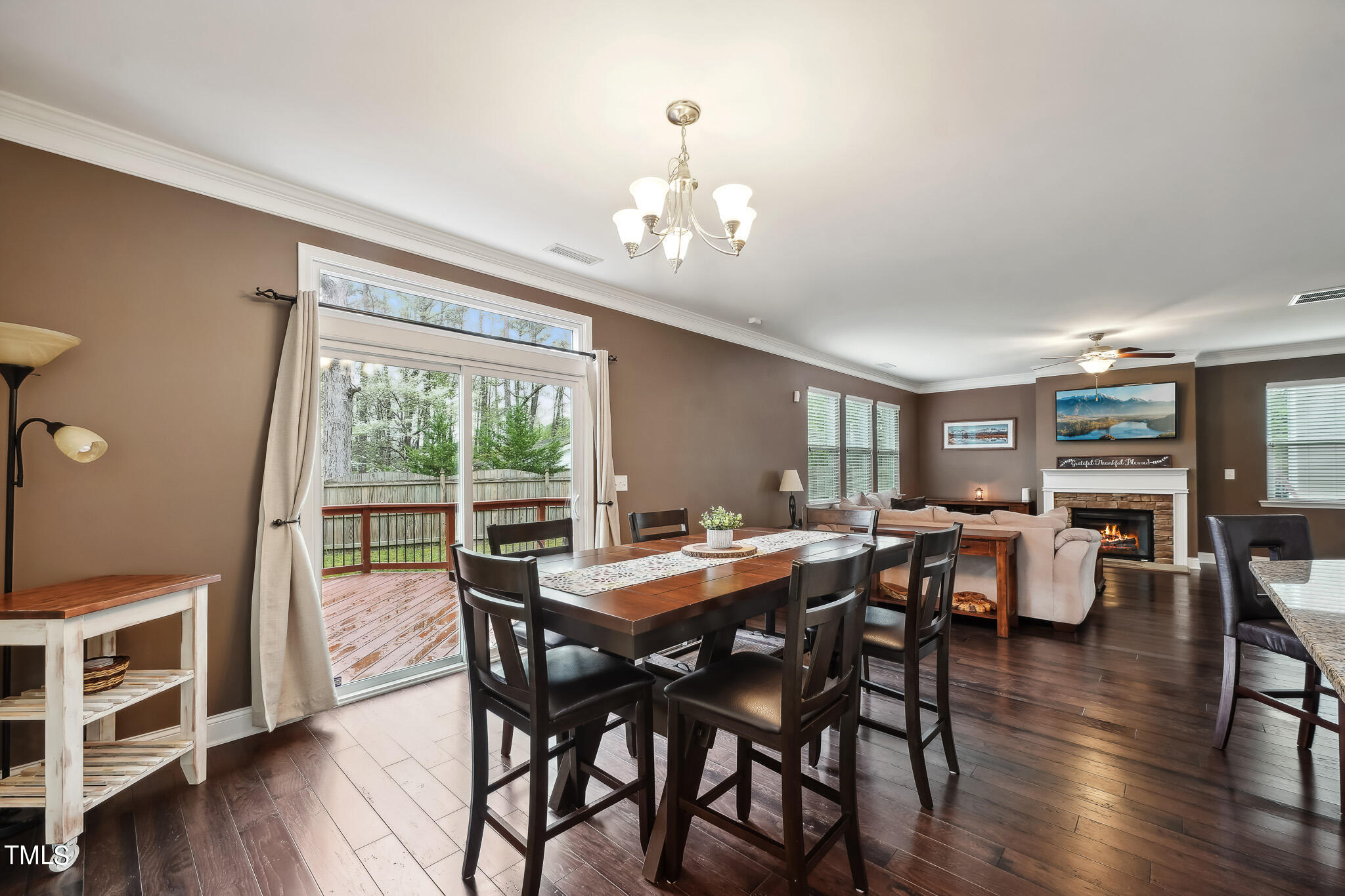 5608 Spring Glen Lane Raleigh, NC 27616 - Photo 15 of 30 a view of a dining room with furniture window and wooden floor
