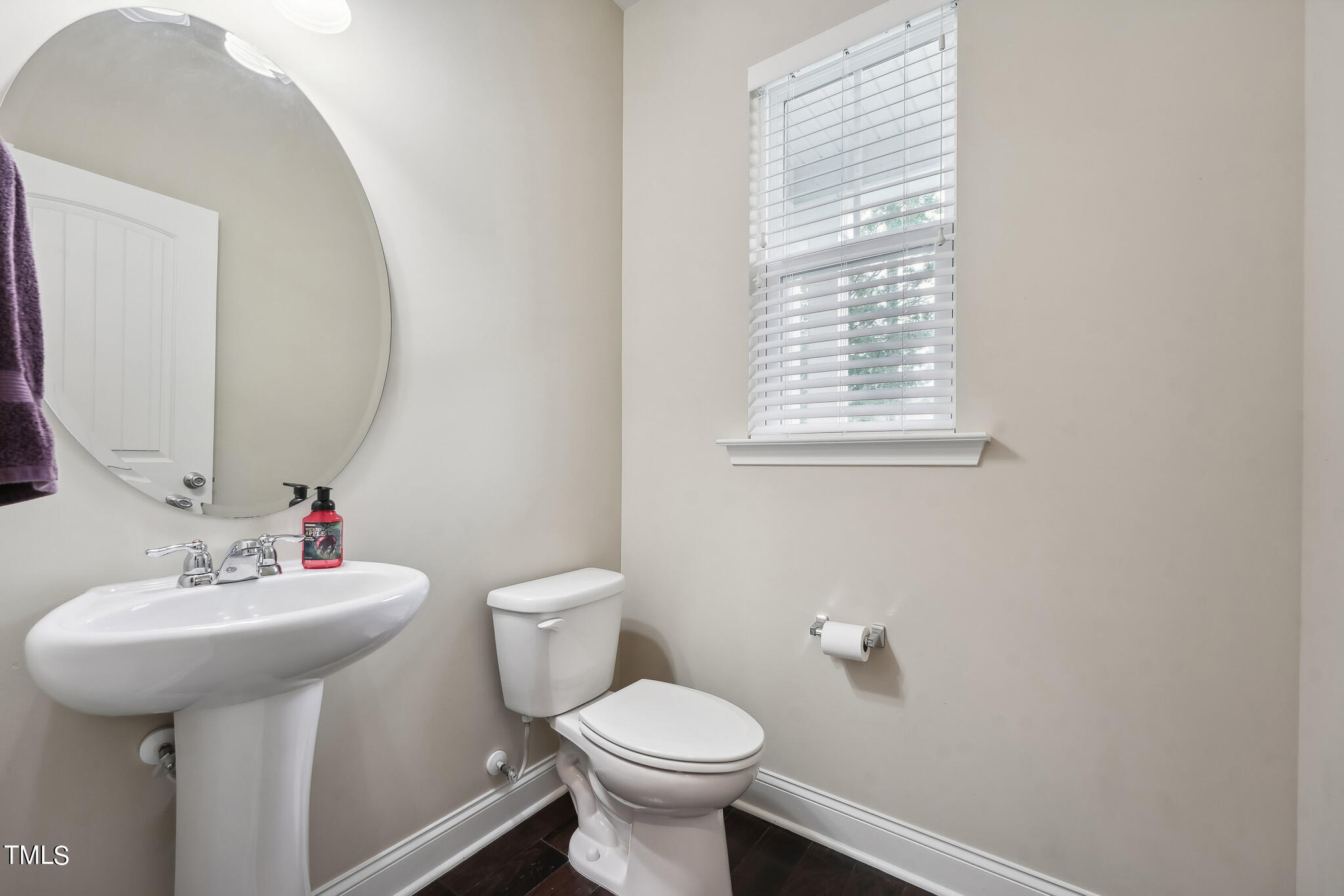 5608 Spring Glen Lane Raleigh, NC 27616 - Photo 16 of 30 a bathroom with a sink toilet and a mirror