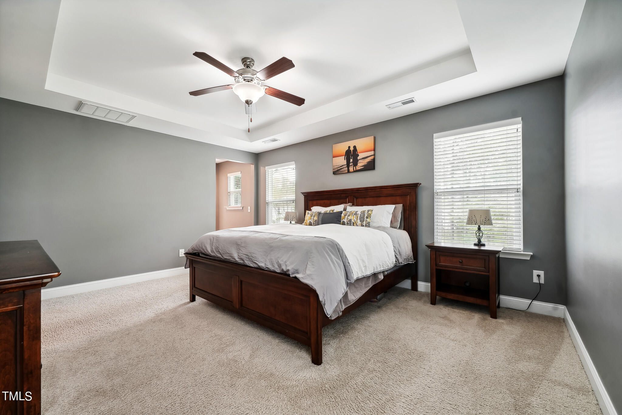 5608 Spring Glen Lane Raleigh, NC 27616 - Photo 20 of 30 a bedroom with a bed and window