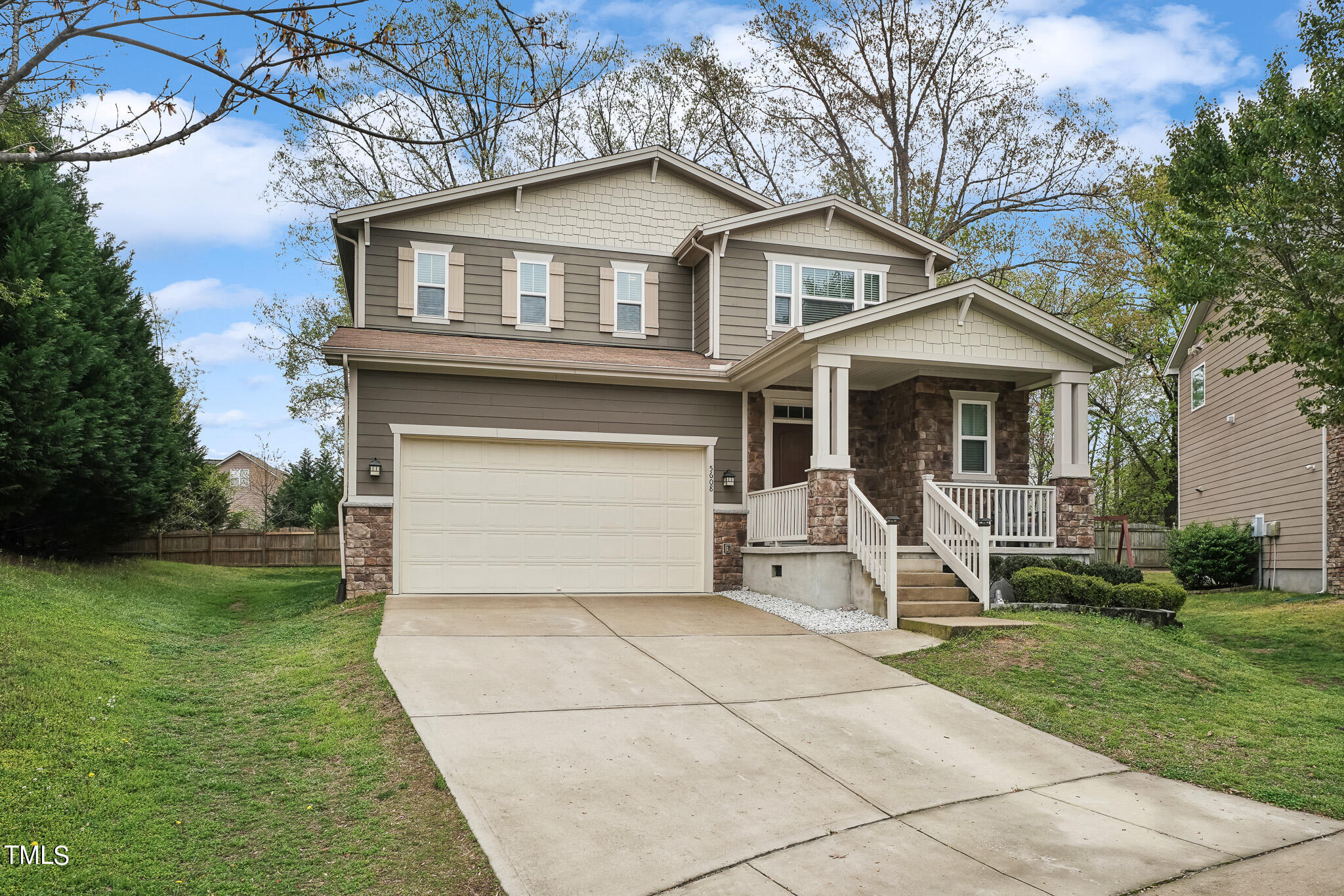 5608 Spring Glen Lane Raleigh, NC 27616 - Photo 2 of 30 a front view of a house with a yard and trees