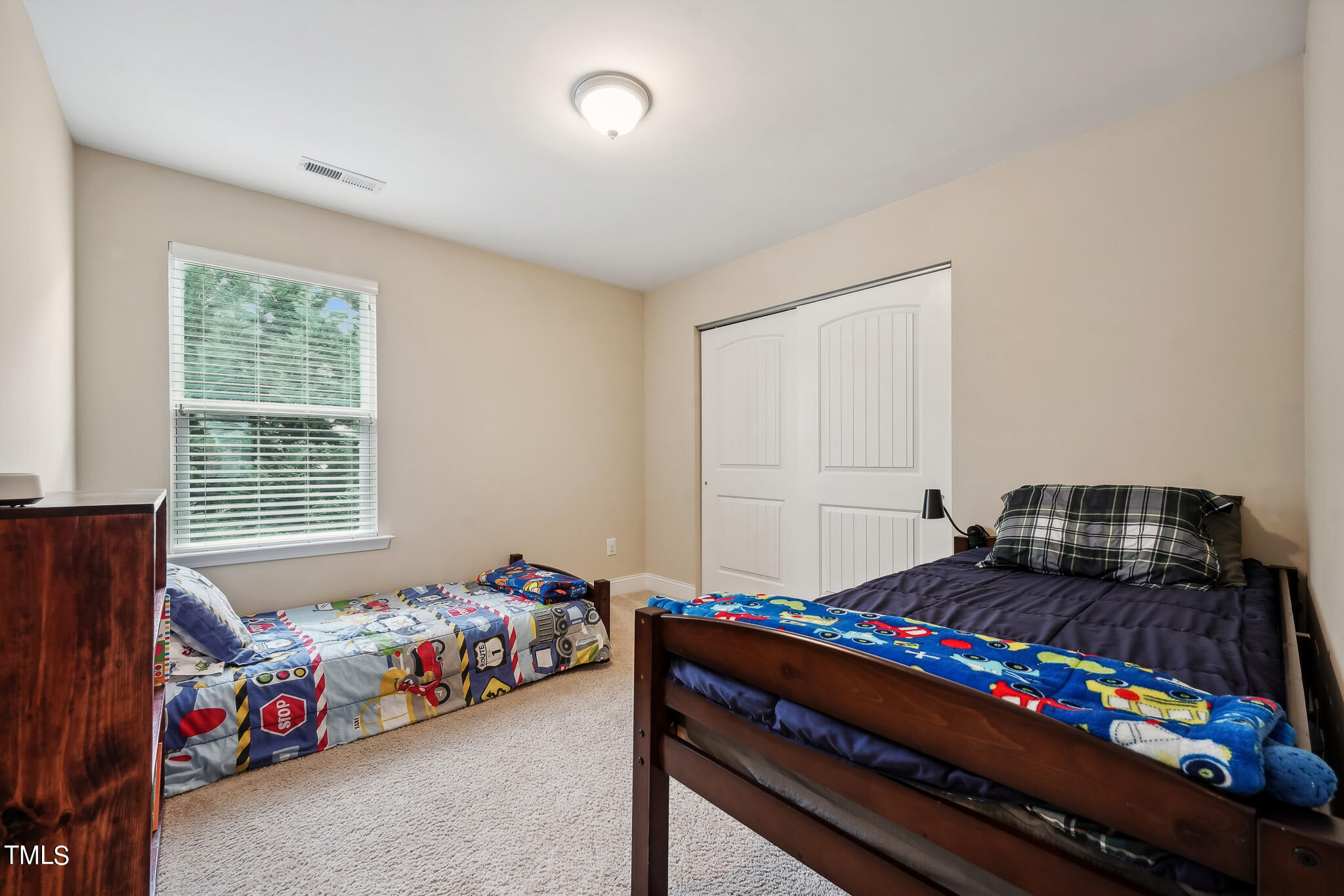 5608 Spring Glen Lane Raleigh, NC 27616 - Photo 22 of 30 a bedroom with bed and window