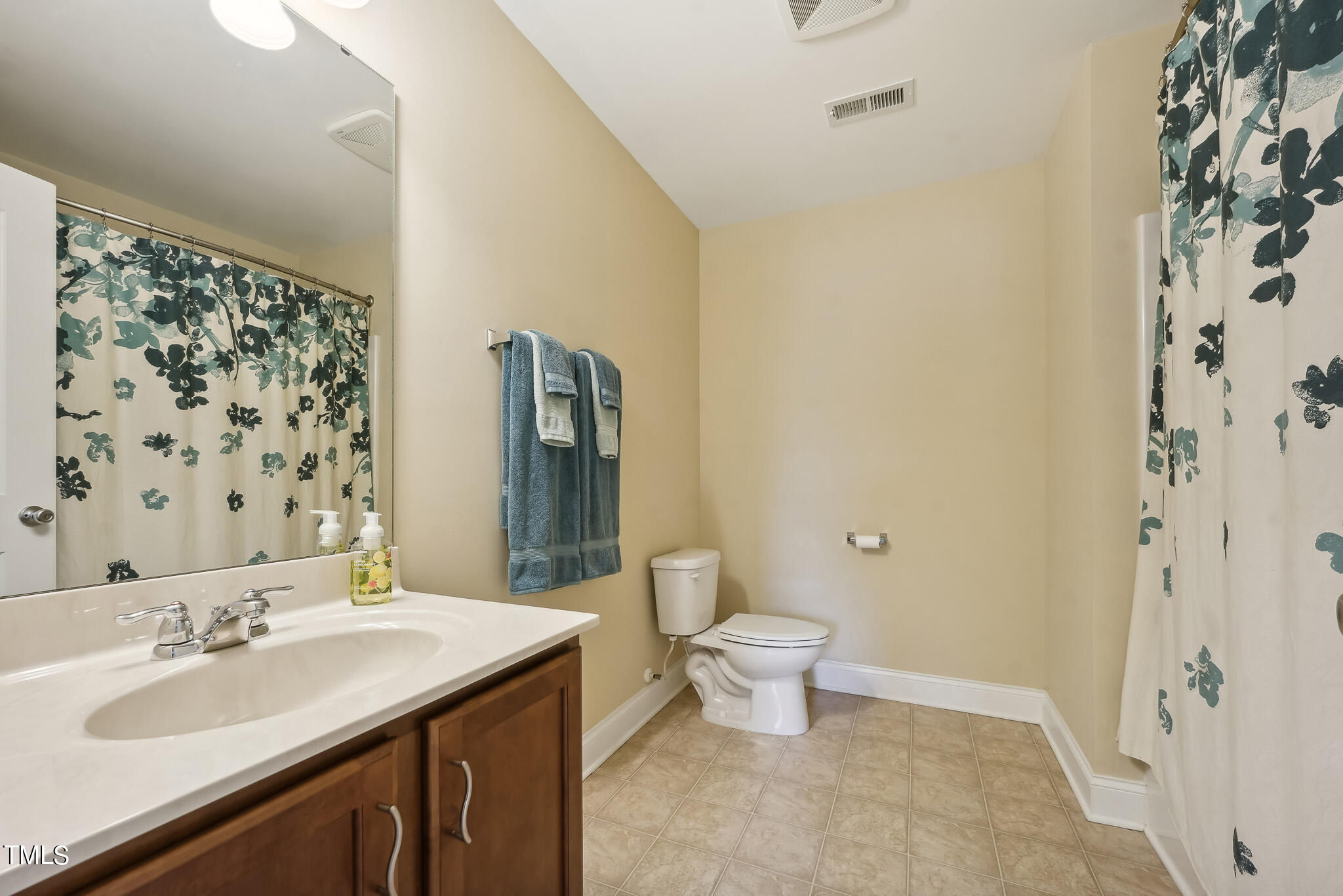 5608 Spring Glen Lane Raleigh, NC 27616 - Photo 24 of 30 a bathroom with a sink toilet and shower